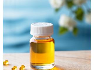 A small glass bottle of Omega-3 fish oil capsules on a wooden surface.